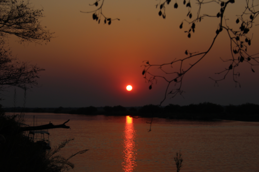 Namibië - Sundown at the okavango