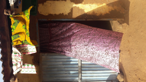 Gambia - Curtain  caught by the wind.