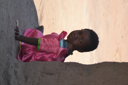 Malawi - A Malawian girl in a little pink princess dress