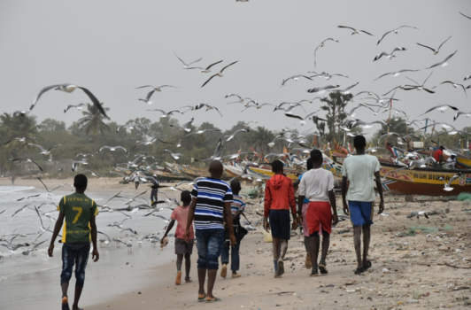 Gambia - Walking on garbage sand
